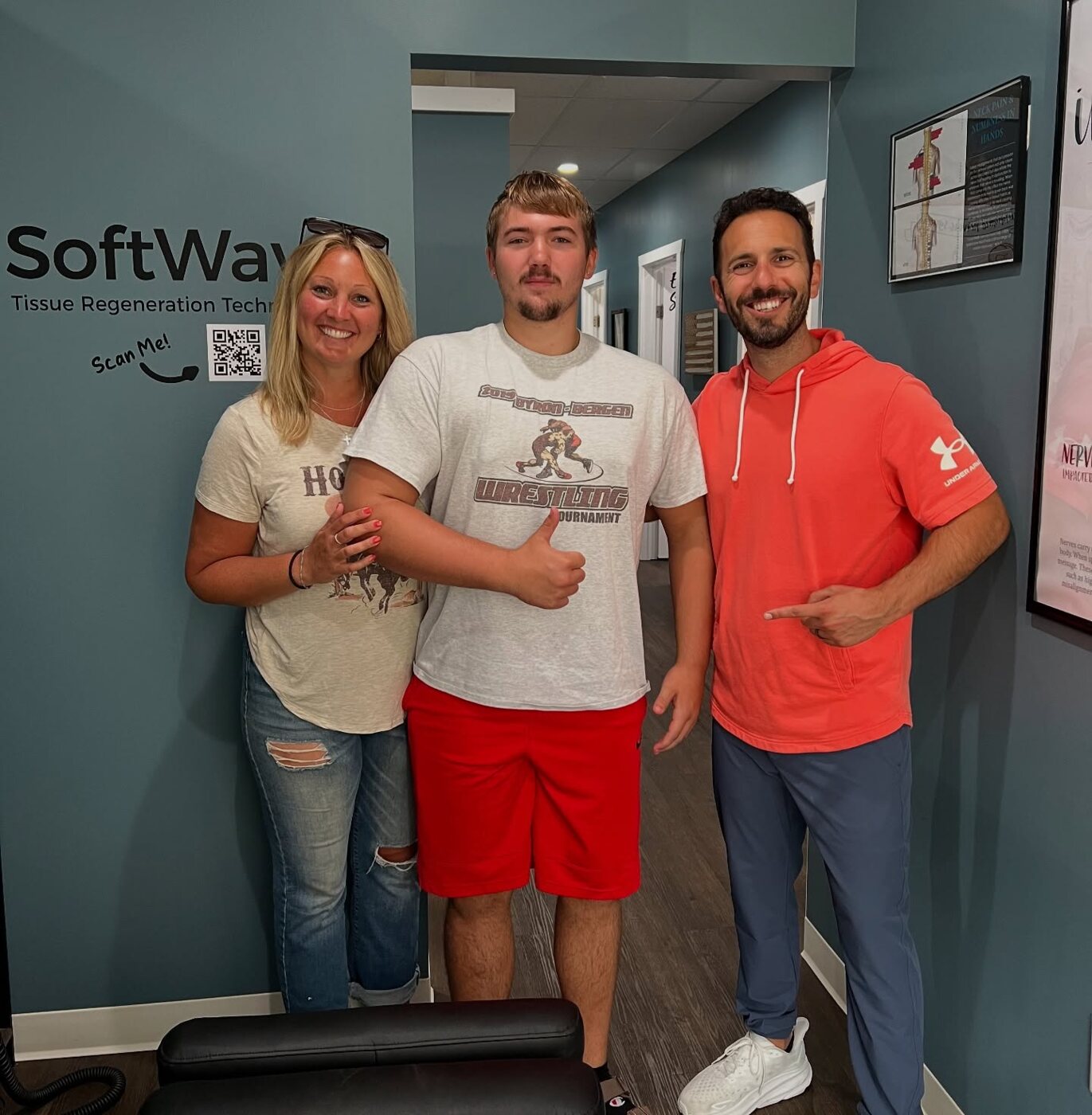 A Byron-Bergen wrestler and his mom with Dr. Sam Camarata after SoftWave Therapy