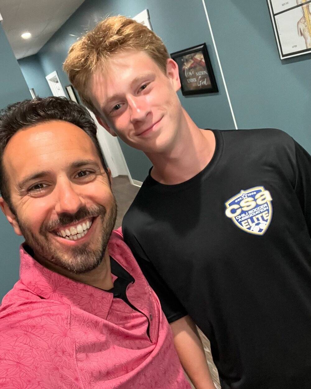 Dr. Sam Camarata with a Chili Soccer Association Elite player at Camarata Chiropractic